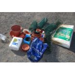 Quantity of plastic flower pots, tub of patio cleaner and mini greenhouse frame (no cover).