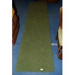 A stitched edge carpet runner 27" x 102".