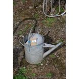 Galvanized watering can.