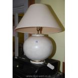 Pottery based table lamp with shade.