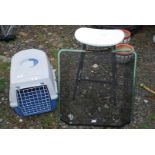Plastic pet carrier, spark guard and kitchen stool.