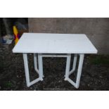 A folding plastic patio/ picnic table.