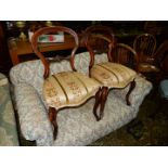 A pair of Victorian Walnut framed side chairs having elegant canted cabriole legs and