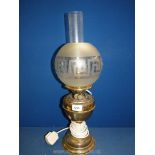 An Oil lamp converted to electric with brass base,