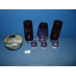 A small quantity of coloured glass including a pair of burgundy vases, mauve vase,