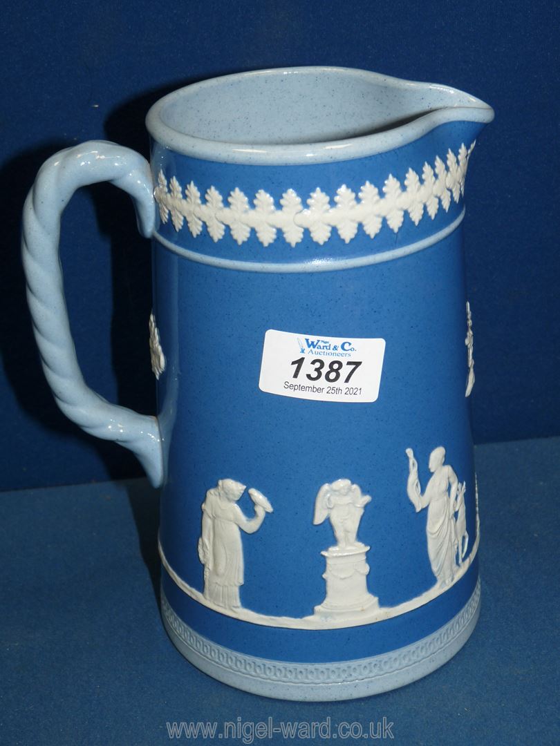 A Dudson Staffordshire glazed Jasperware style pitcher in blue, 7 3/4" tall.
