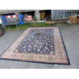 A large Persian 'Royal Classic' wool rug in beige ground with central panel having rows of