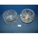 Two crystal glass bowls.