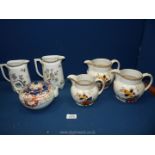 A small quantity of china including three graduated Lawley jugs,