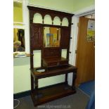 A Victorian carved Oak Hall-stand with Lion mask details and drawer handle,