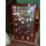 A mirror backed display wall hanging cabinet,