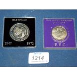 A 1973 Commemorative hands 50 pence piece and a 1947-1972 Isle of Man silver wedding anniversary 5