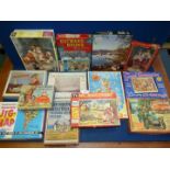 Fourteen vintage wooden and cardboard jigsaw puzzles including; Pip, Squeak & Wilfred,