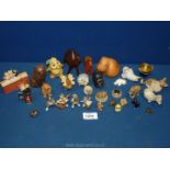 A quantity of animal figures including seal, cow and horse, hippo, cat band, pig, rabbits, mole,