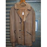 A tan sheepskin Coat with leather trim,