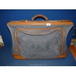 A vintage leather Flilite travel case, (one lock a/f), blue canvas and leather corners, 24" x 17".