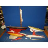 Two wooden pond yachts with sails plus a plastic sailing yacht, yacht lengths - 21", 16 1/2", 15".