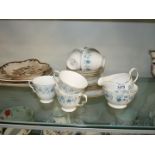 A Colclough part tea set decorated in blue floral and guild pattern to include; 7 cups, 6 saucers,