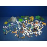 A large quantity of plastic figurines and animals.