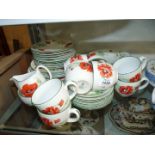 A Royal Worcester 'Poppies' part tea and dinner set to include; 8 cups, 7 saucers, 6 bowls,