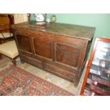 A delightfully plain Georgian three-panel Oak Mule Chest having a pair of drawers to the base,