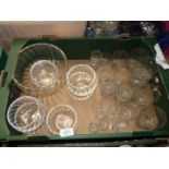 A large crystal swirl bowl with six matching dishes,