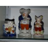 Three Staffordshire Toby jugs including the 'Snuff Taker',