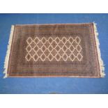 A bordered patterned and fringed brown rug 49" x 77".