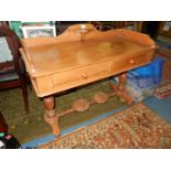 A circa 1900 Satinwood washstand having an up-stand and a pair of frieze drawers with wooden knobs,