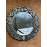 A circular Pewter arts and crafts bevelled glass Wall Mirror with three blue Lapis Lazuli stones to