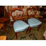 A pair of Mahogany framed crown style backed side chairs having canted cabriole front legs and