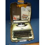 A hard case imperial portable typewriter in green.