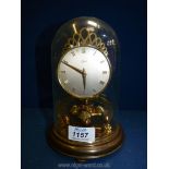 A Schatz domed anniversary clock with Roman numerals. 8" tall.