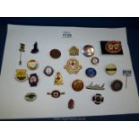 A quantity of enamel badges including; Teddy Tails, Red Cross, Girl Guides, etc.