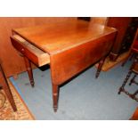 A circa 1900 Mahogany Pembroke Table standing on turned legs and having a drawer to one end,