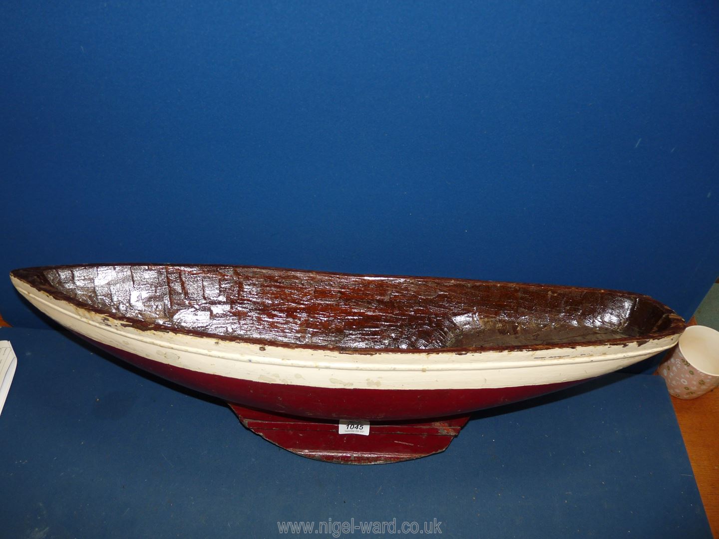 A hand carved red and white model boat, 30" long x 8" wide. - Image 2 of 3