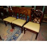 Three Chinoiserie style arched backed Mahogany framed side Chairs standing on square legs united by