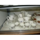 A Wedgwood metalised bone china Demitasse coffee set including five cups and saucers,