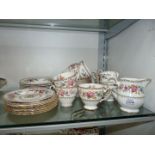 A Grafton Malvern part Teaset in cream with pink and blue floral pattern consisting of nine cups,