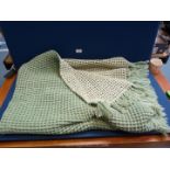Pure Welsh wool waffle blanket in green and cream with two fringe edges. 64" x 55".