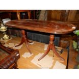 An appealing Mahogany Occasional Table in the style of a double-pedestal 19th c.