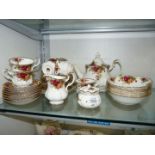 A Royal Albert Country Roses Teaset including seven cups and saucers, six tea plates,