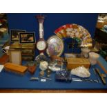 A quantity of miscellanea including decorative tins, pink glass shades, quartz crystal,