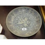 A heavy Oriental style shallow dish, possibly a souvenir piece,