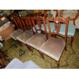 A set of four Edwardian Mahogany dining Chairs having extremely delicate fretworked and carved