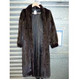 A dark Mink fur Coat with clip fastenings, full length with clip fastenings, medium.