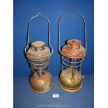 Two vintage Tilley oil lanterns.