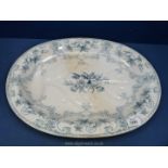 A large raised meat platter in blue & white with a drainage section, 19 1/2" x 15", hairline crack,