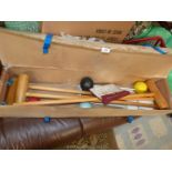 A croquet set in box including four mallets, four balls etc.