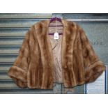 An elegant vintage brown mink style jacket/swing coat with 3/4 length sleeves. Size medium.